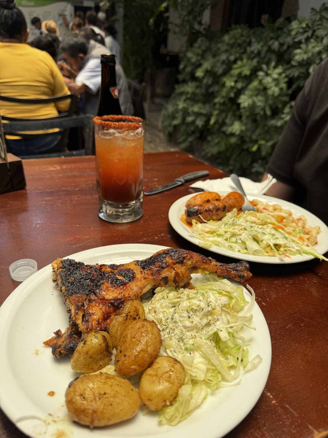 Pollo a la lena plate with potatoes and cabbage salad at Rinconcito Antigueno